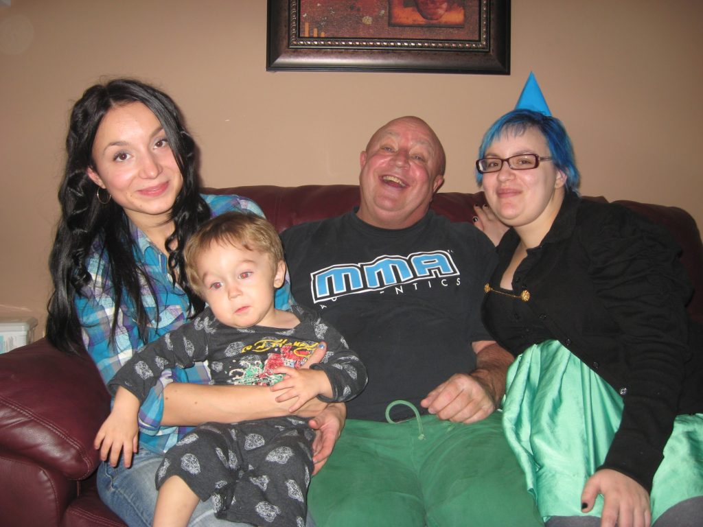 My dad and sister and me, with my nephew